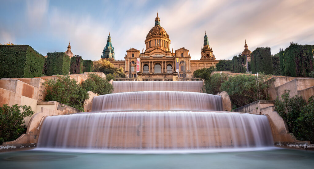Palau Nacional atop Montjuic Hill with waterfalls and lush gardens in Barcelona