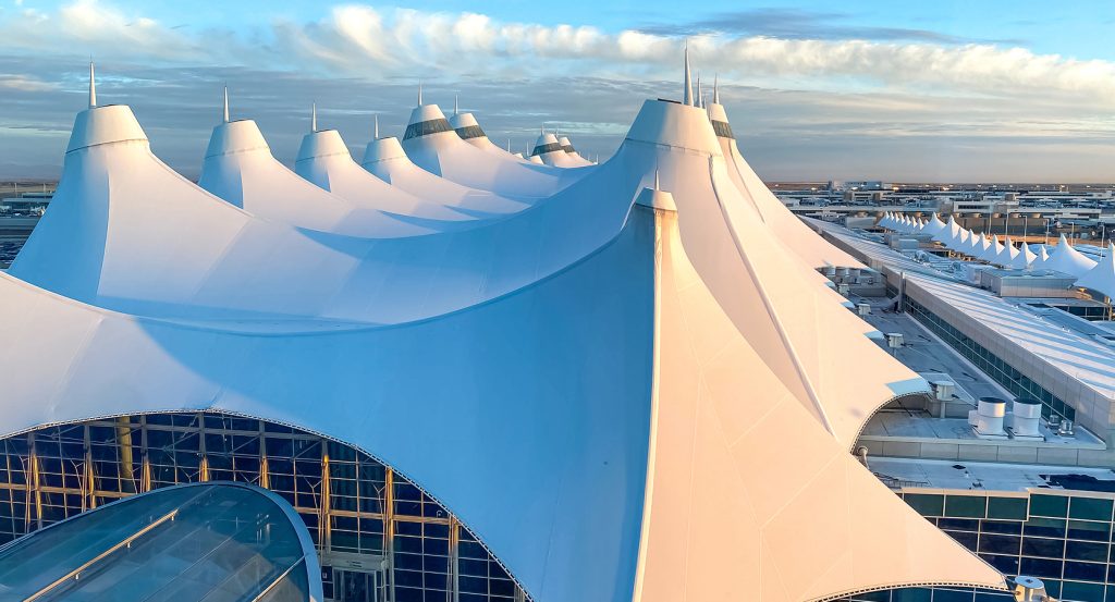 Interior view of Denver Airport’s terminal with glass and steel design