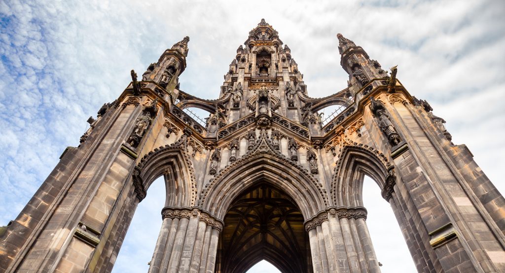 Scott Monument towering over Princes Street with Edinburgh skyline