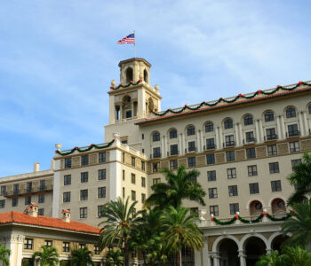 Exterior view of The Breakers Palm Beach with its historic Italian Renaissance architecture and palm-lined grounds.