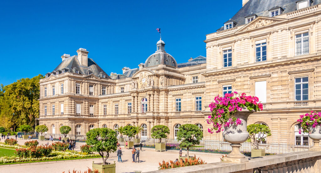 Historic Luxembourg Palace in Paris with flowers and courtyard