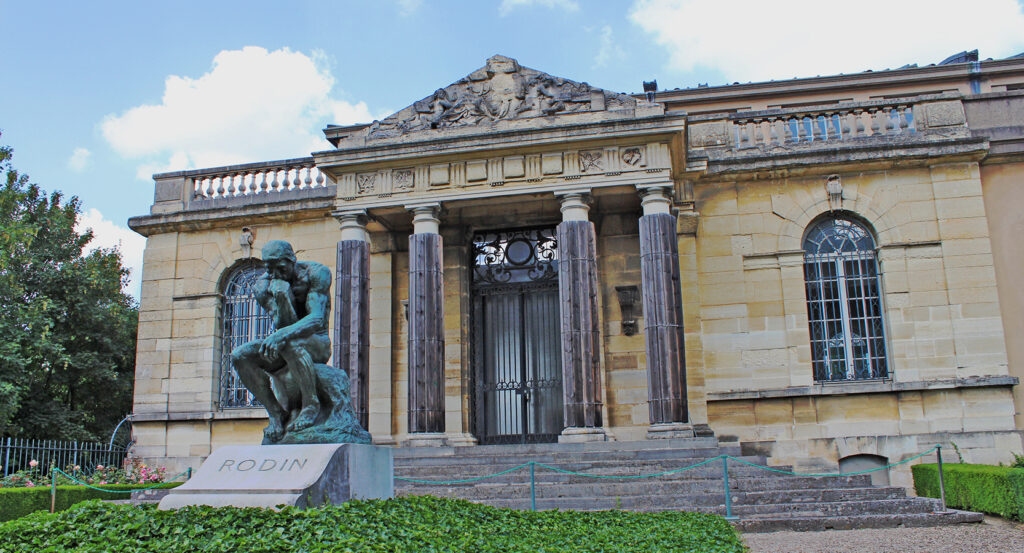 Entrance of Musee Rodin with bronze statue in foreground