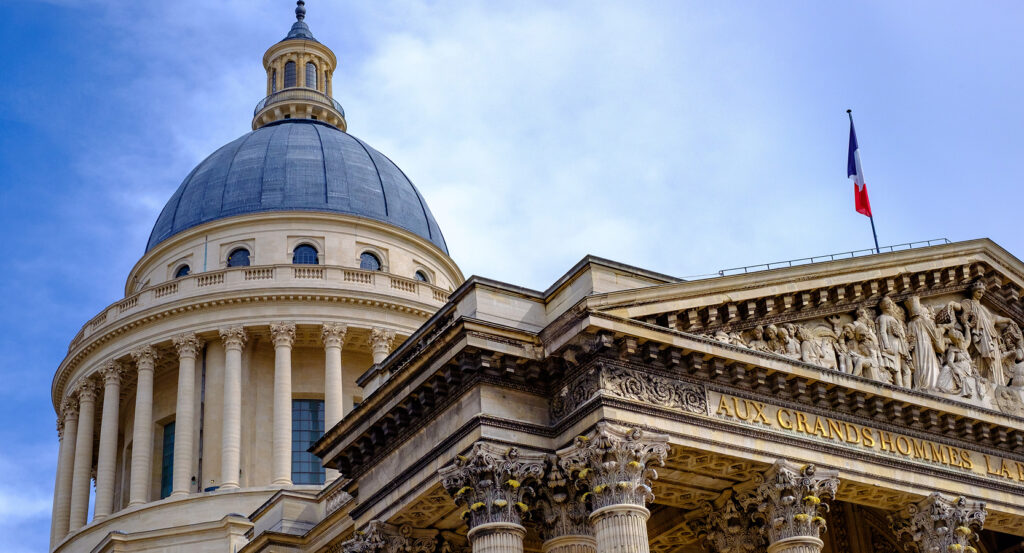 Front facade of the Pantheon in Paris with Corinthian columns and inscription