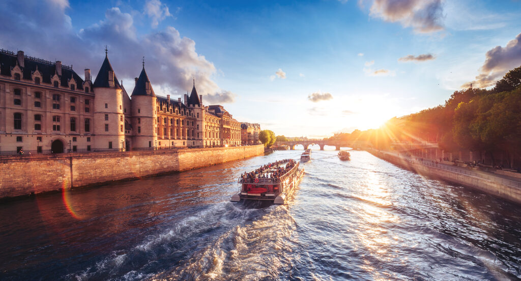 Seine River boat cruise passing historic Paris architecture