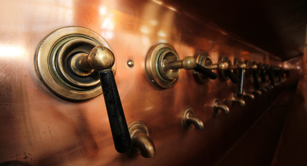 Interior of the Heineken Experience with brewery equipment