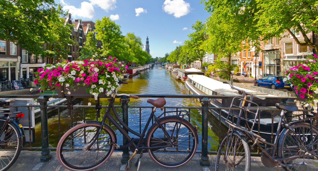 Traditional houses and canal boats in Jordaan district of Amsterdam