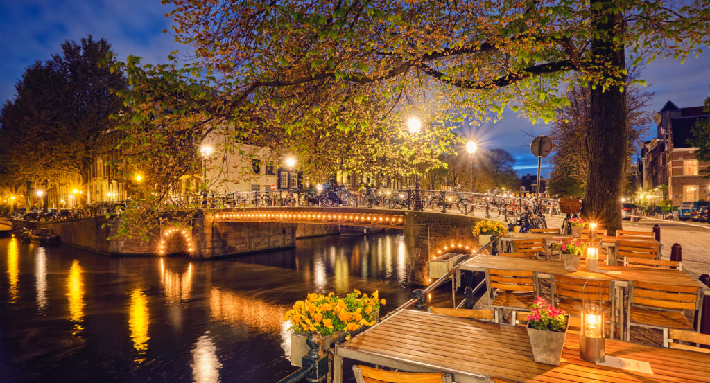 Outdoor café along canal in the 9 Streets district of Amsterdam