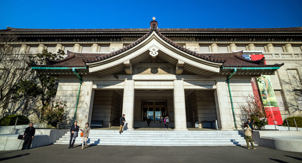 Visitors walking up the steps to the Tokyo National Museum entrance.