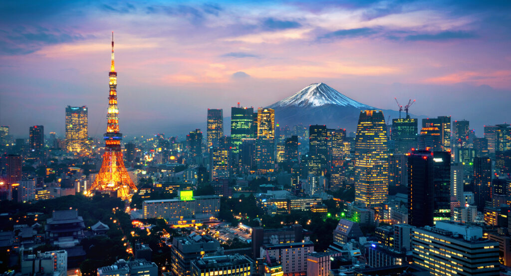 Tokyo Tower illuminated at night above the Tokyo skyline