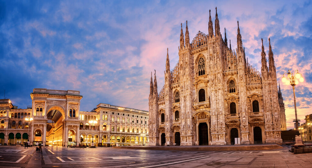 Rooftop view of Milan Cathedral with spires and city skyline