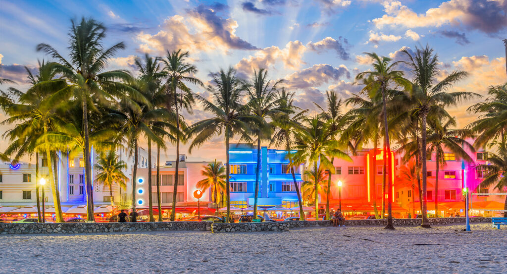 Ocean Drive in South Beach Miami lit up at night with pastel Art Deco facades