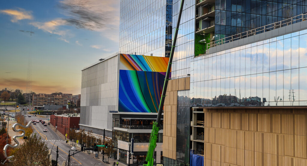 Bright rainbow mural decorates the façade of a glass building in Nashville, Tennessee.