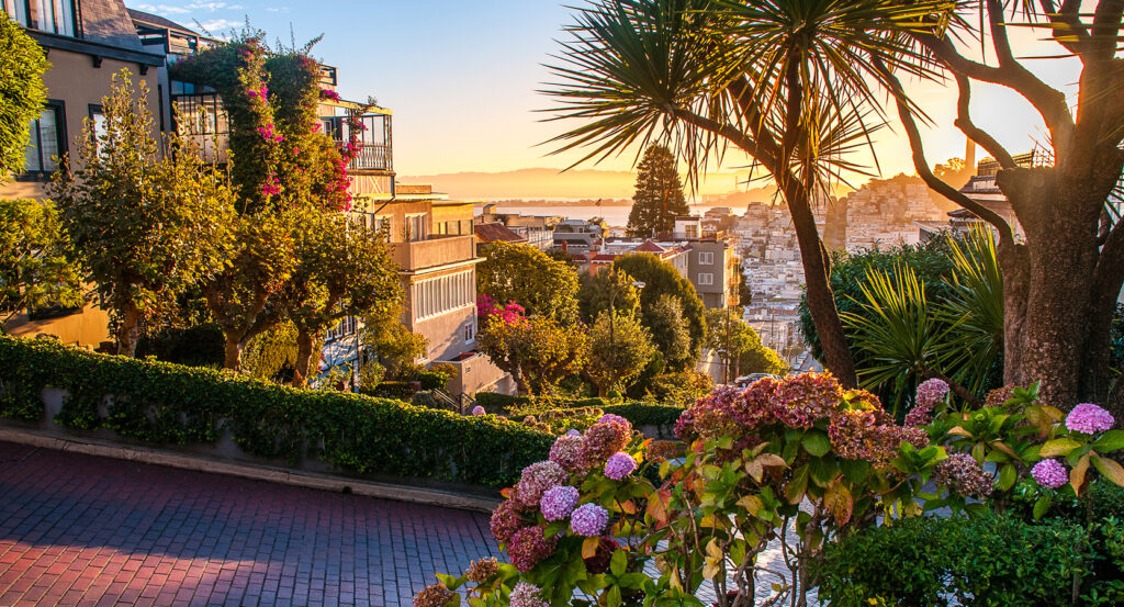 The iconic crooked Lombard Street lined with flowers and colorful houses