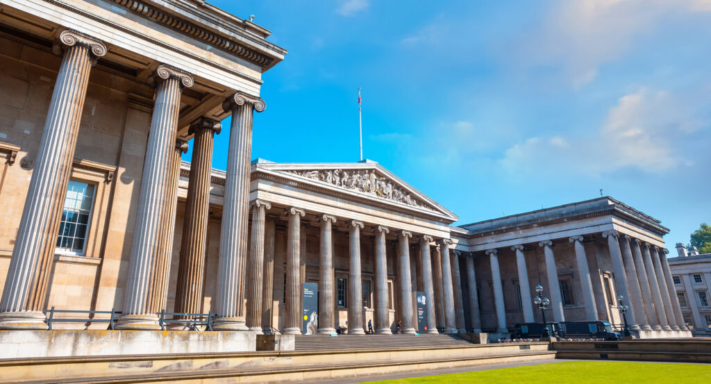 British Museum entrance with grand pillars and blue sky