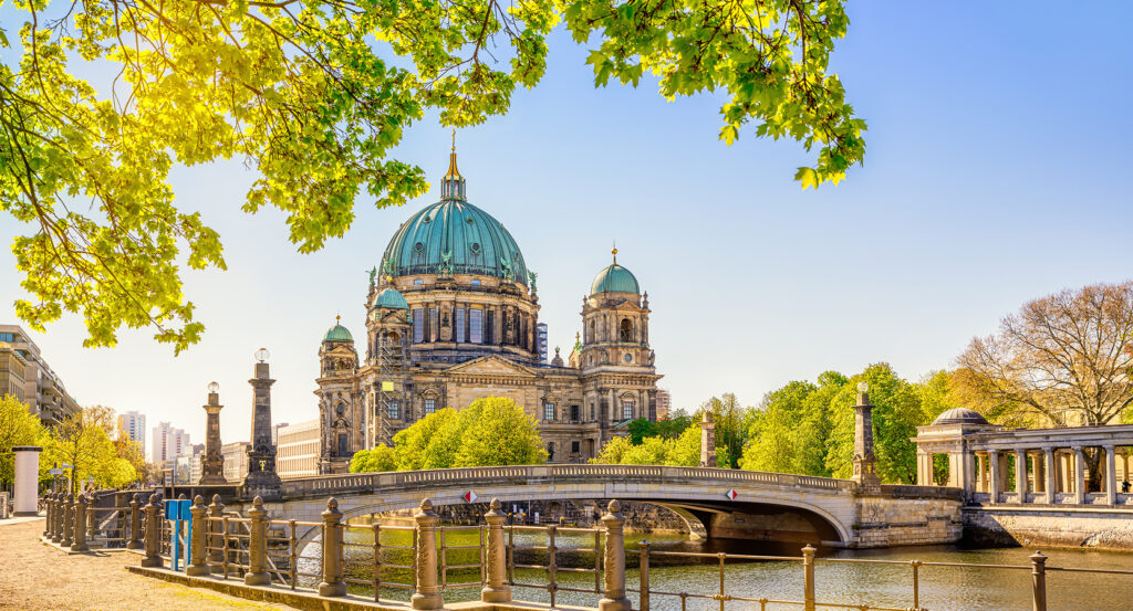 Dome of Berlin Cathedral glowing at sunset over the city