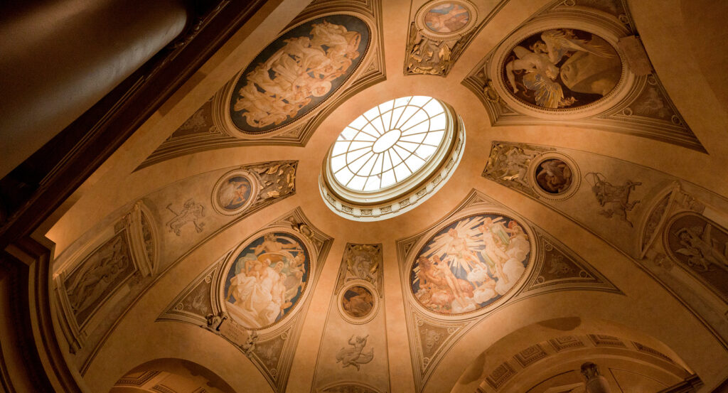 Interior rotunda at the Museum of Fine Arts Boston with historic artwork