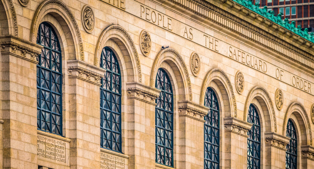 Historic stone facade of Boston Public Library in Copley Square