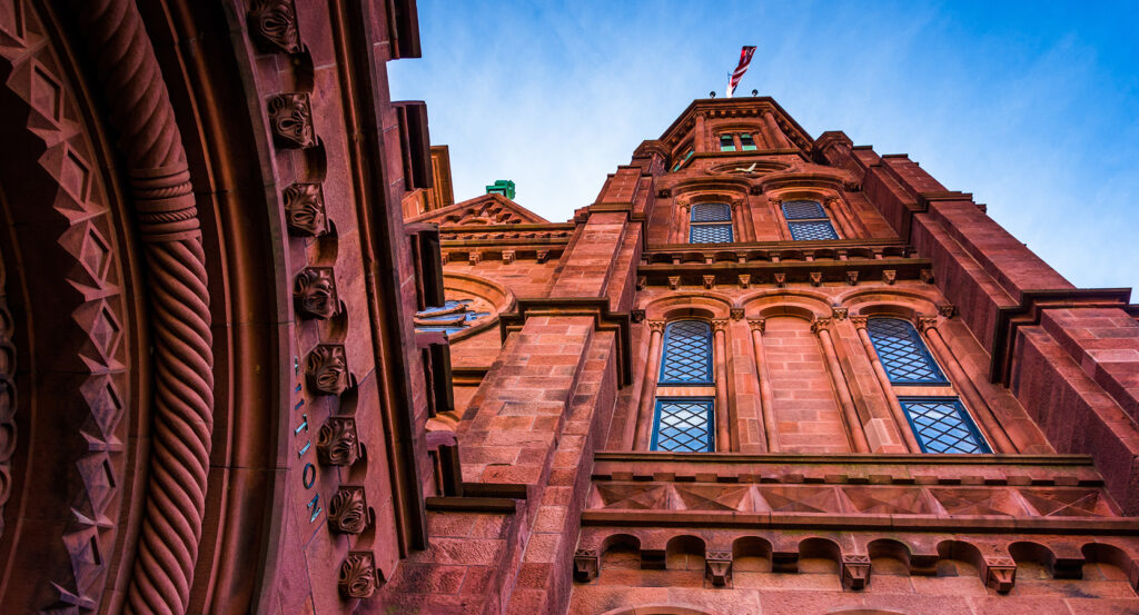 The Smithsonian Castle against a blue sky in Washington DC