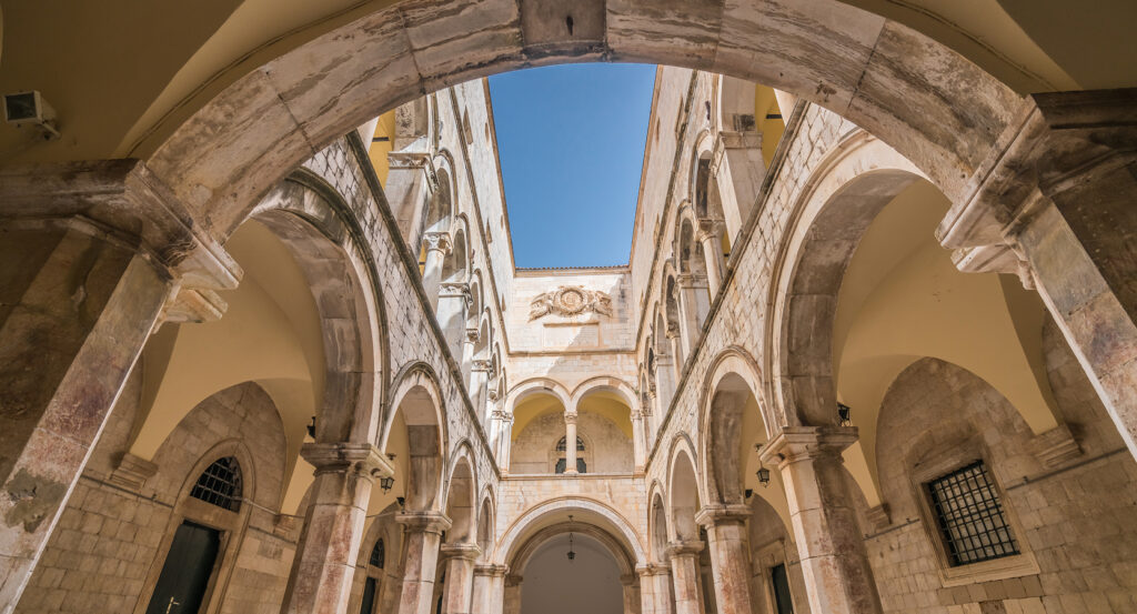 Gothic-Renaissance façade of Sponza Palace under blue sky