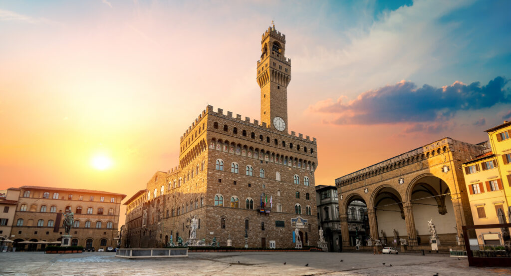 Palazzo Vecchio clock tower rising over Piazza della Signoria in Florence