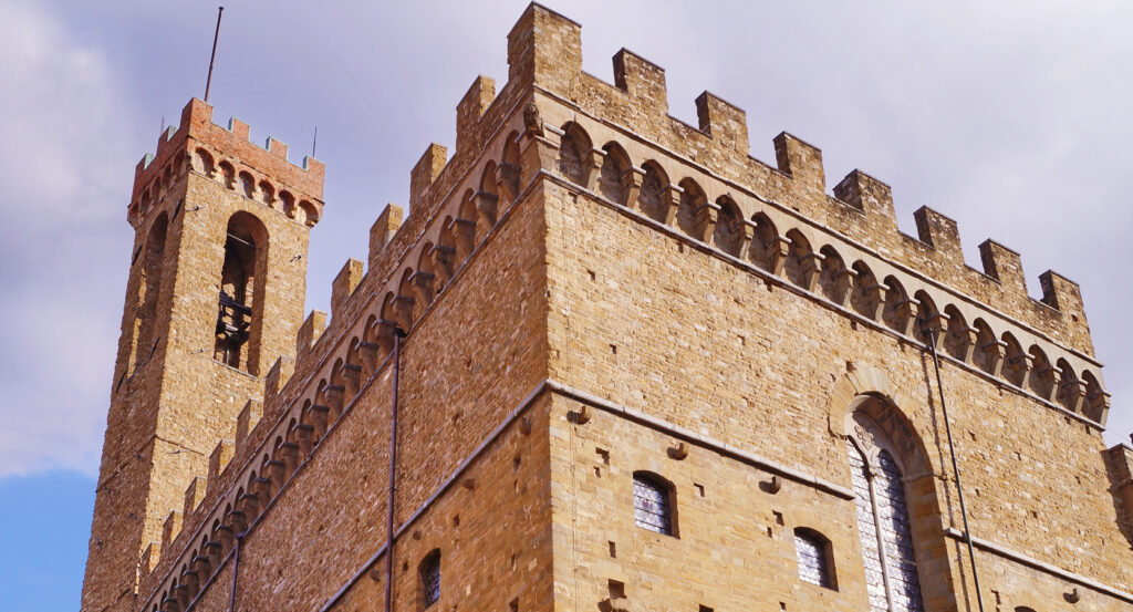 Towering stone walls of the Bargello Museum, Florence, against the sky