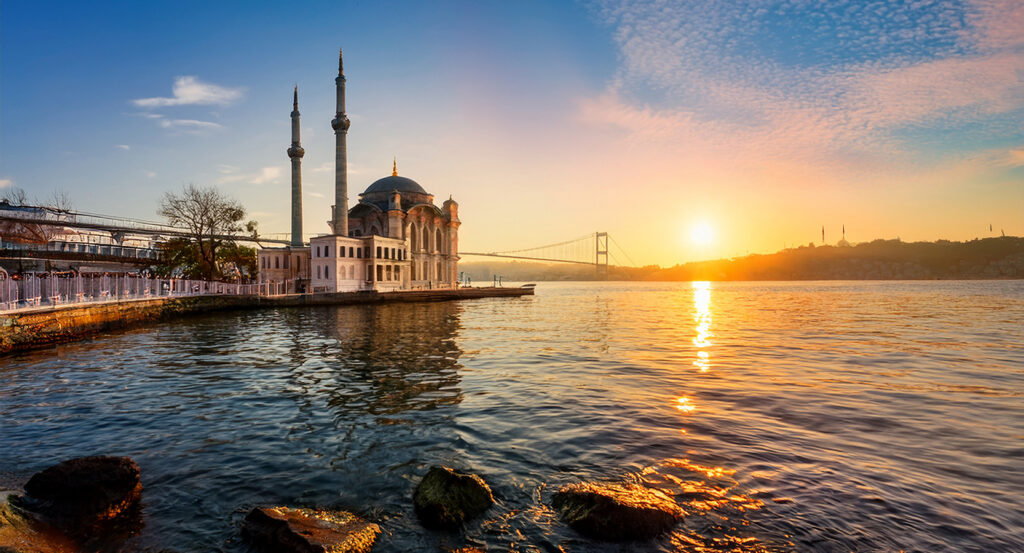 Scenic view of the Bosphorus at dusk with mosque and bridge in Istanbul, Turkey