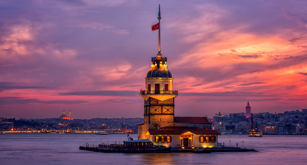 Istanbul's Maiden's Tower with city skyline and twilight sky in the background