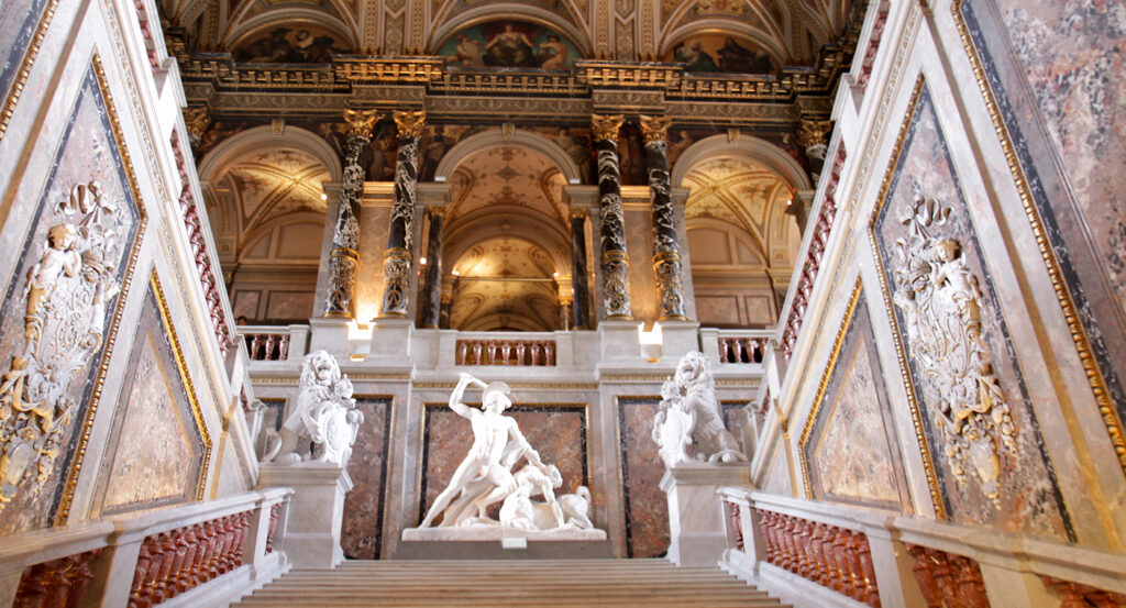 Ornate hall and statues inside Kunsthistorisches Museum Vienna