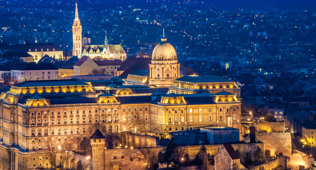 Buda Castle glowing over the Danube in Budapest