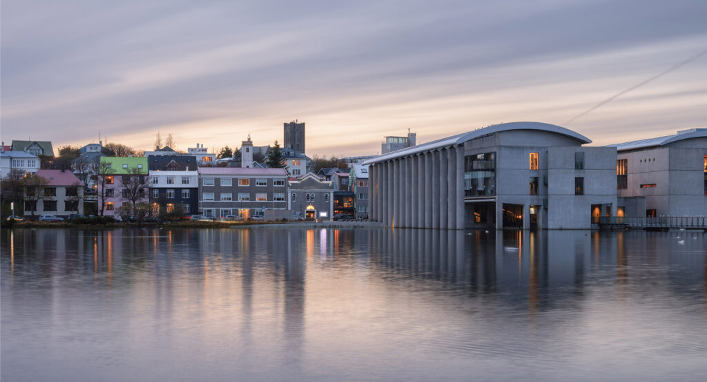 Front view of Reykjavík City Hall with its columns along Tjörnin lake