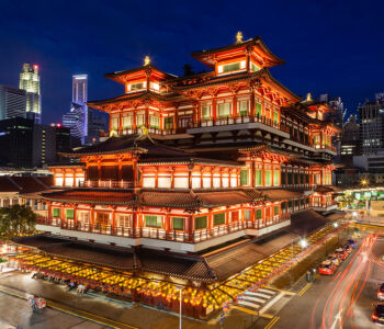 Buddha Tooth Relic Temple glowing at night in Singapore’s Chinatown