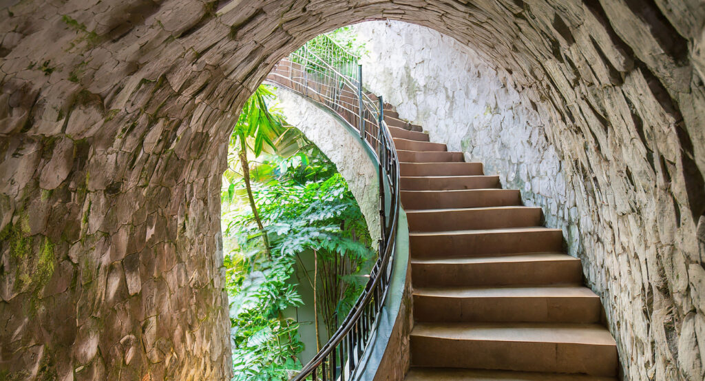 Scenic tunnel and stairway surrounded by greenery at Fort Canning Park