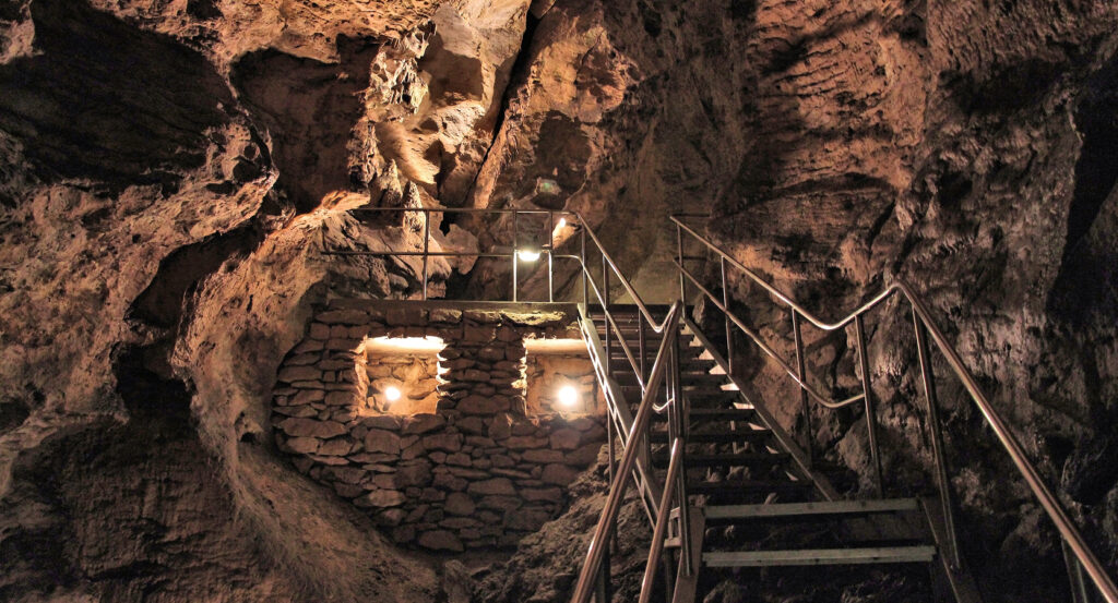 Underground chamber of Budapest's City Caves with rock formations and lighting