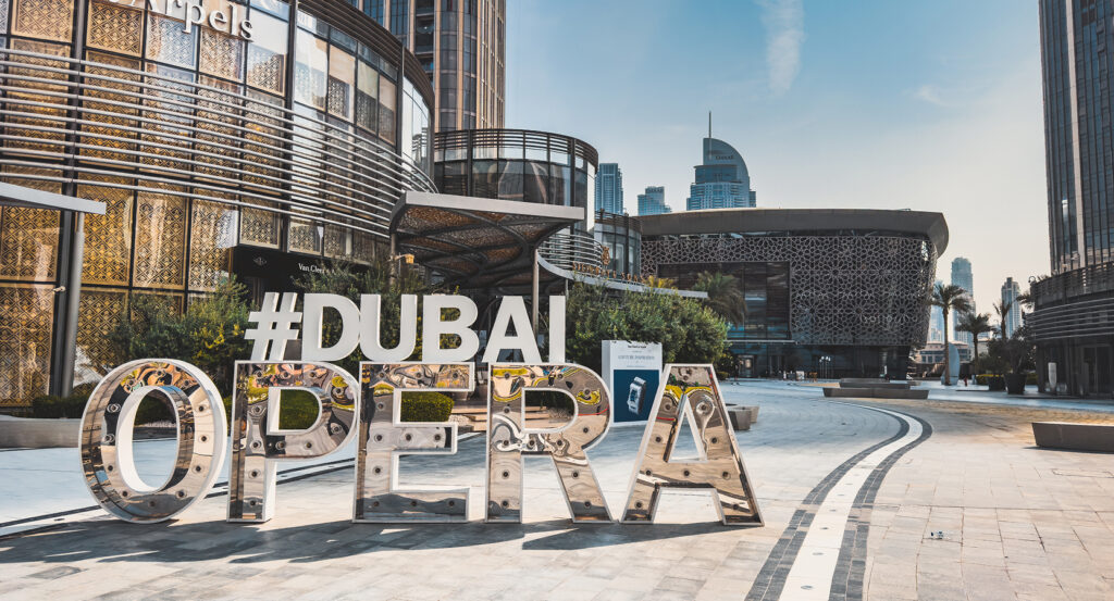 Exterior view of Dubai Opera shaped like a dhow boat