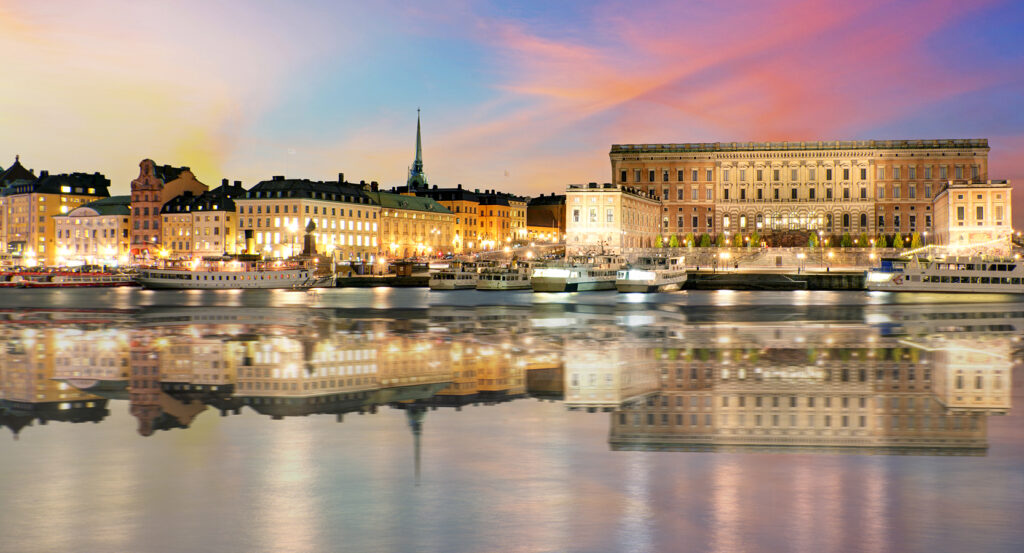 Evening view of Stockholm Palace with city lights