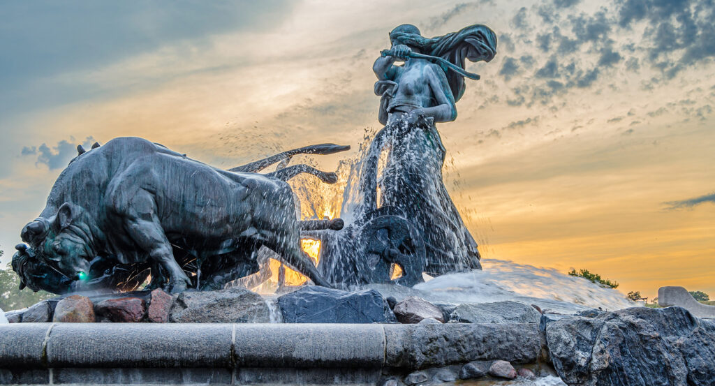 Bronze oxen and goddess statue with water cascading at Gefion Fountain