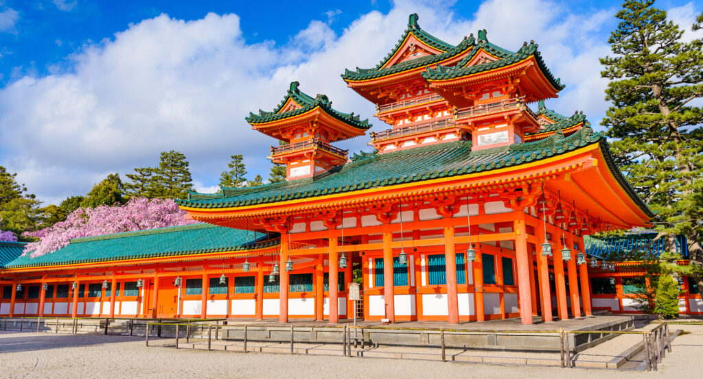 Heian Shrine garden view with torii and cherry blossoms
