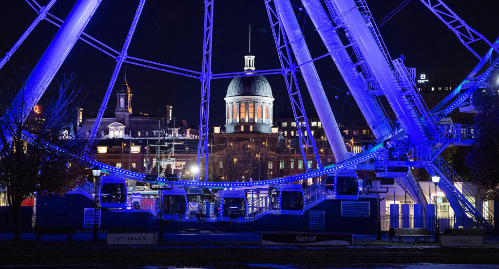 Night view of Bonsecours Market with Ferris wheel lights
