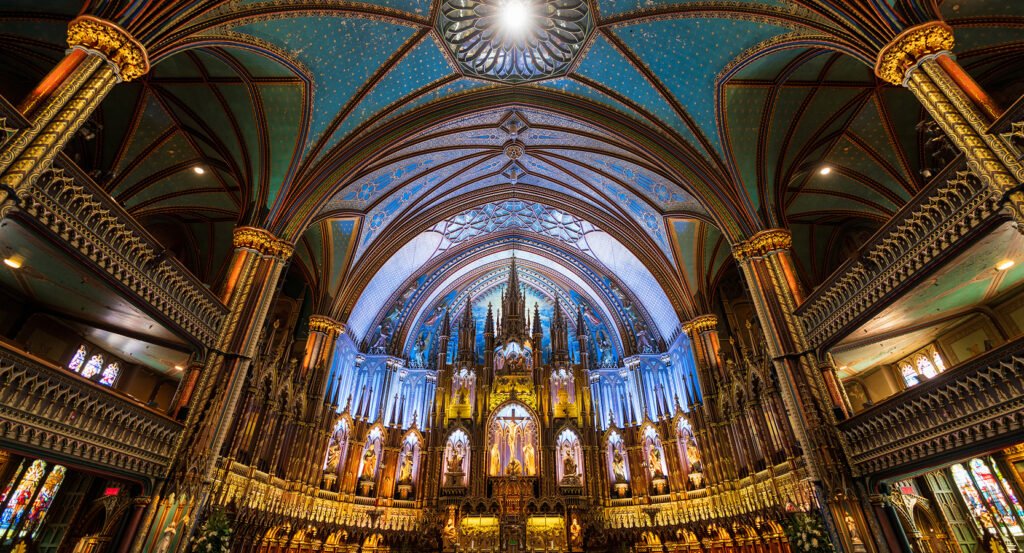Stained glass and golden altar inside Notre-Dame Basilica in Montreal