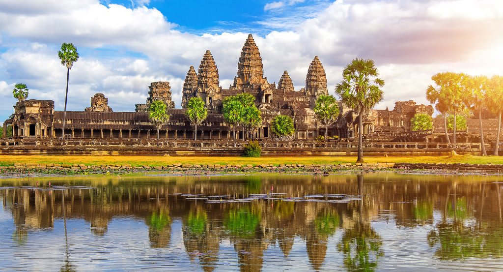 Angkor Wat temple silhouette with dramatic clouds and cosmic symmetry