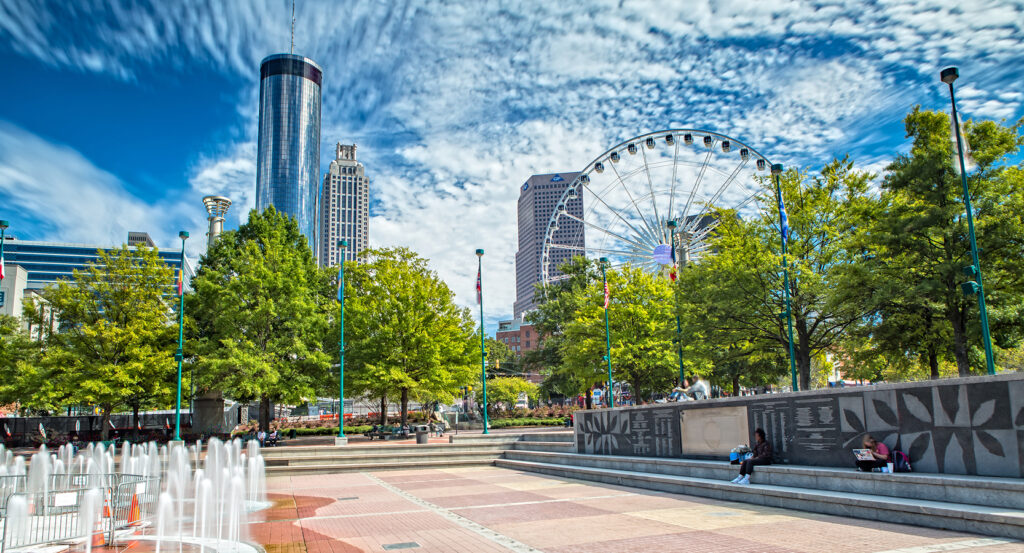 Ferris wheel and skyscrapers rising above Centennial Olympic Park in downtown Atlanta.