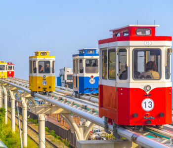 Vibrant sky capsule monorail gliding along Busan’s coastline