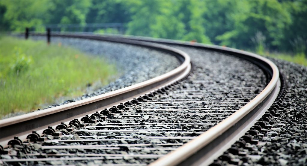 Historic railway lines winding into the distance along Sacramento’s lush landscape.