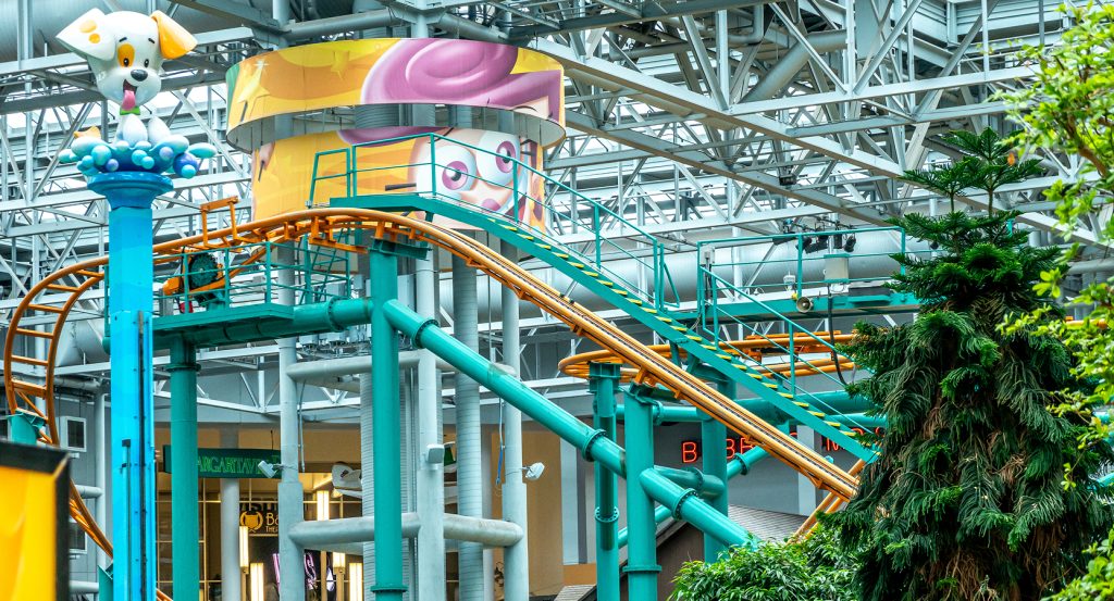 View of the twisting tracks and cartoon-themed rides at the indoor amusement park in Mall of America.