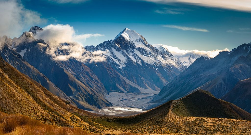 Scenic view of the Southern Alps with Mount Cook in the distance from a hiking trail in Queenstown.
