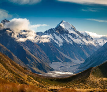 Snow-capped mountains and glacial valley near Queenstown, New Zealand.