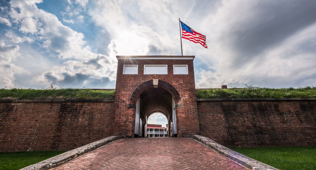 Historic Fort McHenry in Baltimore, with the U.S. flag waving proudly in the wind.