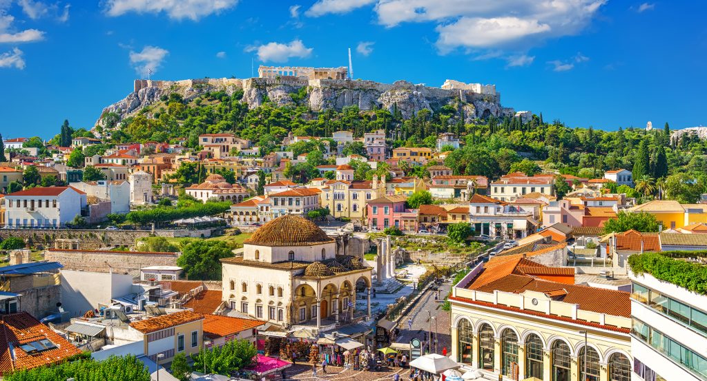 Historic Athens skyline featuring the Parthenon atop the Acropolis and vibrant neighborhood architecture
