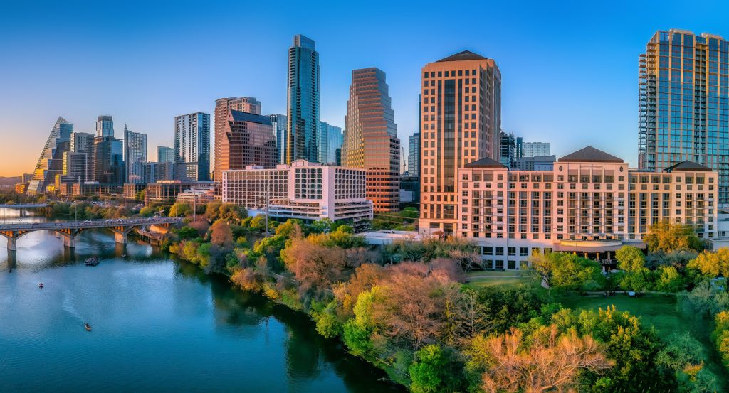 Modern skyscrapers and leafy riverbanks along Austin’s scenic waterfront.