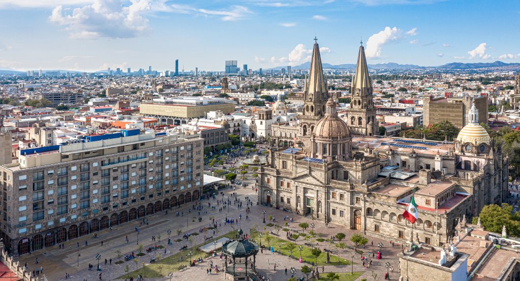 Guadalajara’s historic cathedral and surrounding cityscape seen from above on a sunny day.